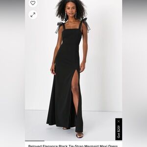 Black dress with shoulder tie bows that add a pop of fun